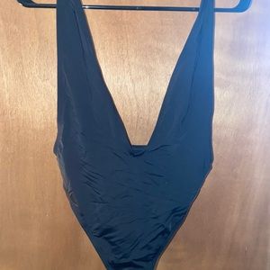 Low cut black one piece